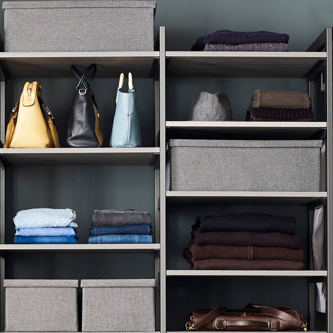 Spacious closet with built in shelves and two levels of hanging space by  Lawrence Homes, Inc, Photogra…