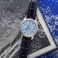 Grand Seiko SBGA407 watch with blue Snowflake dial and crocodile strap.