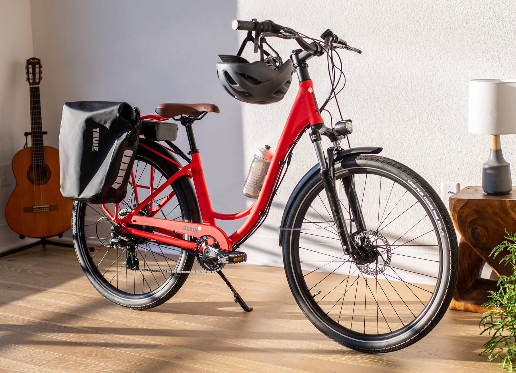 Charge electric bike in red with panniers