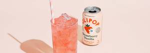 A can of olipop strawberry vanilla served in a glass with ice