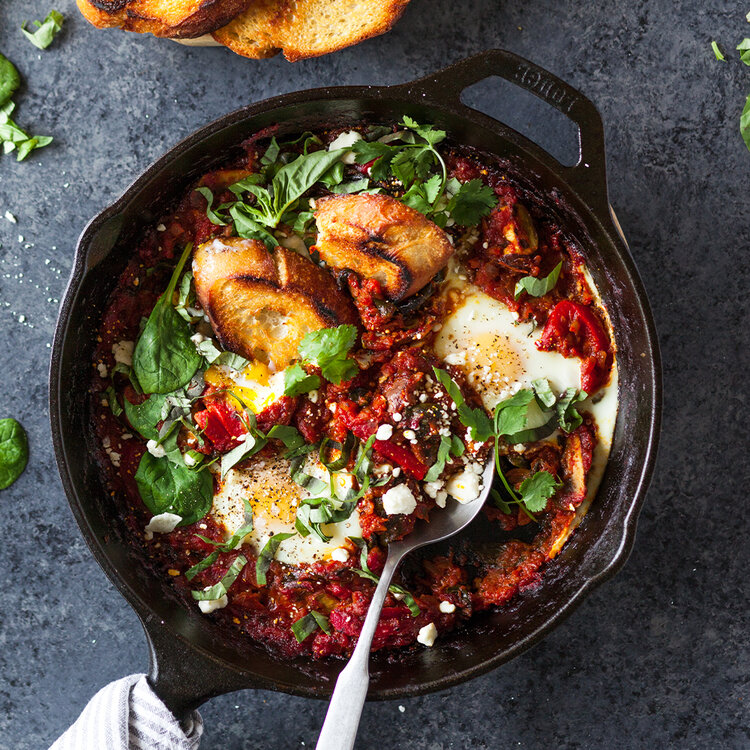 Veggie shakshuka made with Sonoma Gourmet's cherry tomato basil sauce and roasted chiles olive oil