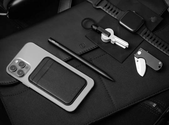 iPhone with MagSafe cardholder, Apple watch, Apple Pen and slim Key Holder on laptop sleeve