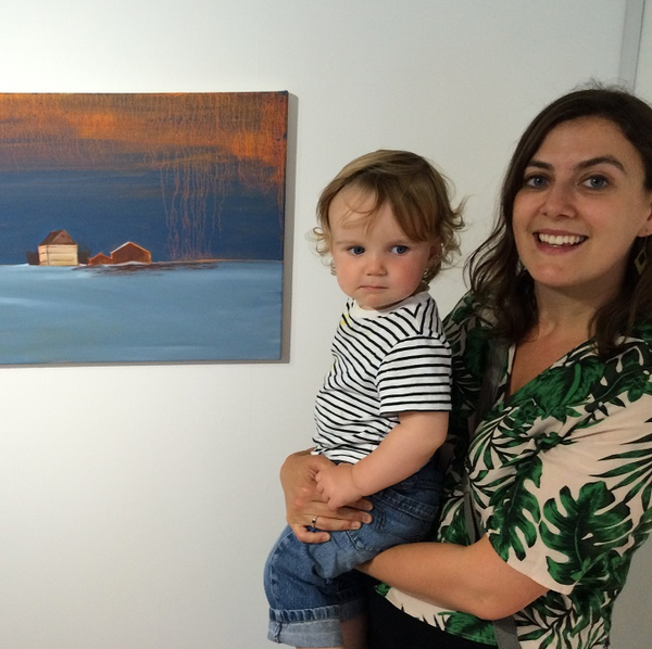 artist catherine knight with her child by one of her paintings