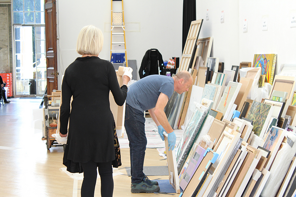 volunteers stack artworks during RWA selection day