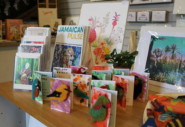 display of children's books and artists' merchandise in RWA shop