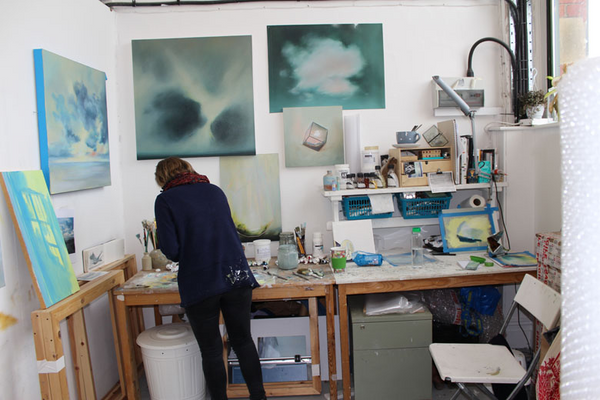 photo of jemma grundon in her studio space at a desk