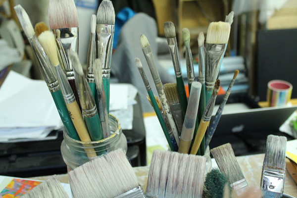 photo of paintbrushes in a jar