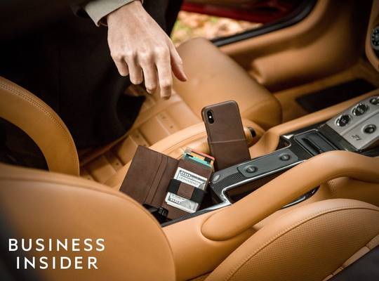Ekster smart leather wallet inside luxury vehicle