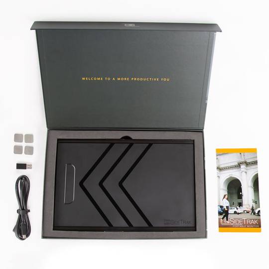 aerial view of the sidetrak slide black monitor for laptop inside of the box with components