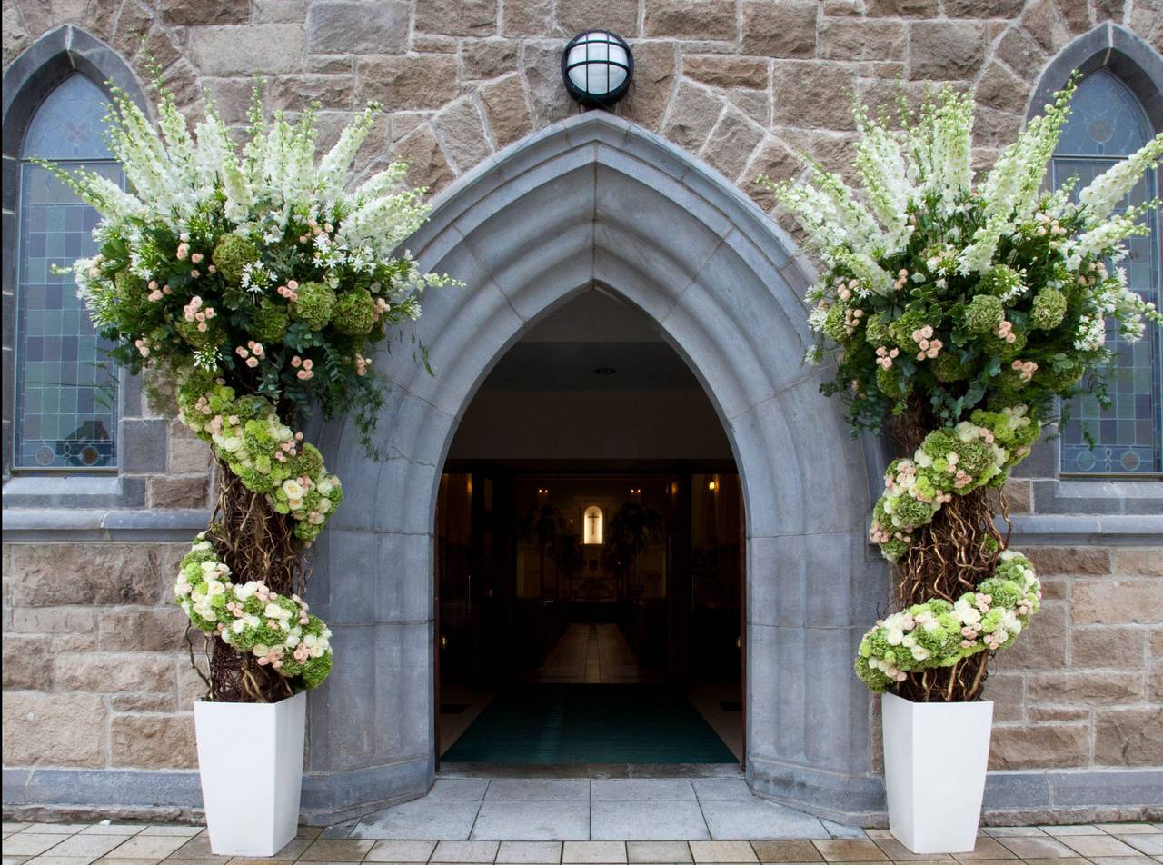 Flower planters outside a church.