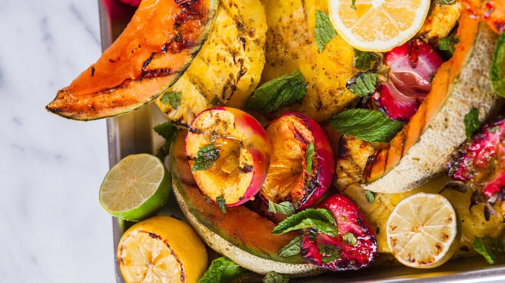 Grilled fruit salad with hot honey made with Sonoma Gourmet's basil parmesan olive oil