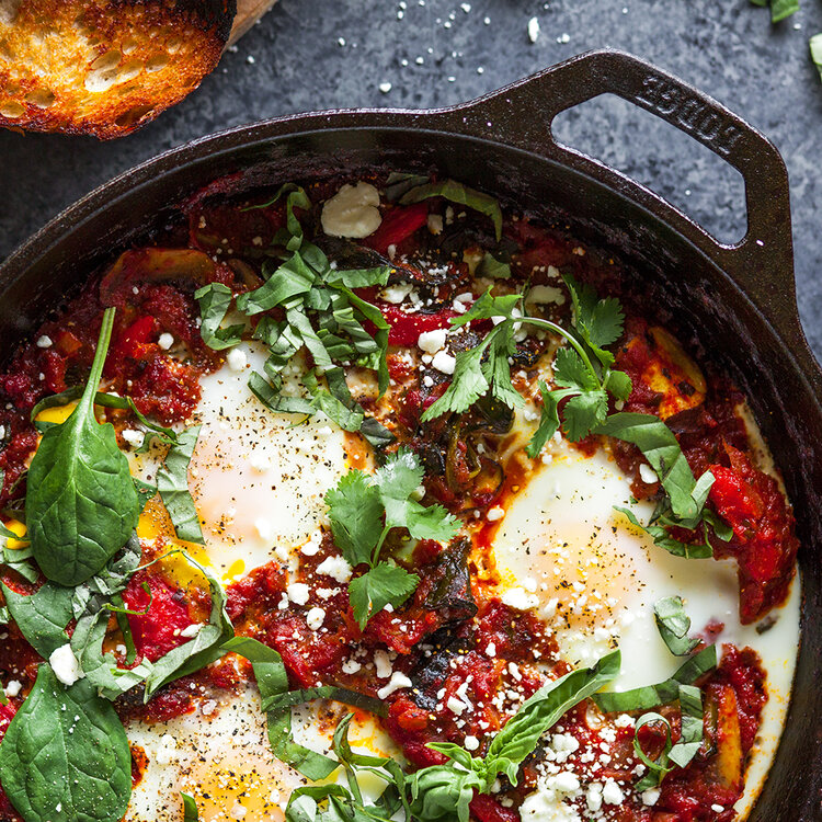 Veggie shakshuka made with Sonoma Gourmet's cherry tomato basil sauce and roasted chiles olive oil