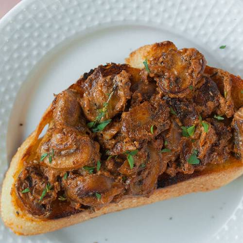 Saucy mushroom toast made with Sonoma Gourmet's sauteed garlic olive oil and cherry tomato basil sauce