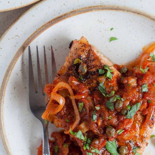 Pan-roasted salmon with tomato sauce made with Sonoma Gourmet's roasted garlic sauce