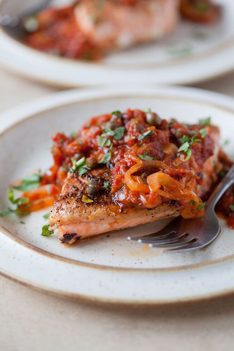 Pan-roasted salmon with tomato sauce made with Sonoma Gourmet's roasted garlic sauce
