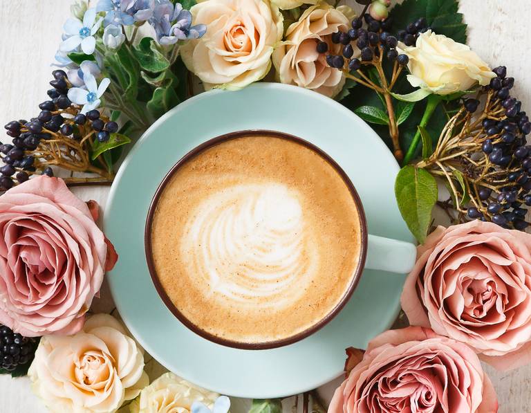 Pumpkin Spice Hot Latte from above surrounded by flowers