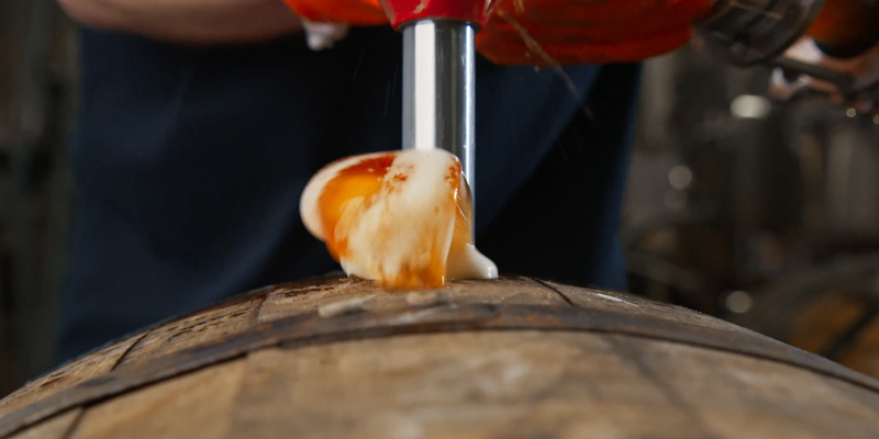 Filling a barrel with beer for aging