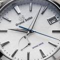 Grand Seiko SBGA211 - macro detail of the fine textured snowflake dial and blue accents.
