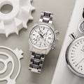 Grand Seiko chronograph SBGC201 - white dial, stainless steel wristwatch atop a gray table. 
