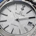 Grand Seiko wristwatch STGK011 - macro of white textured dial. 