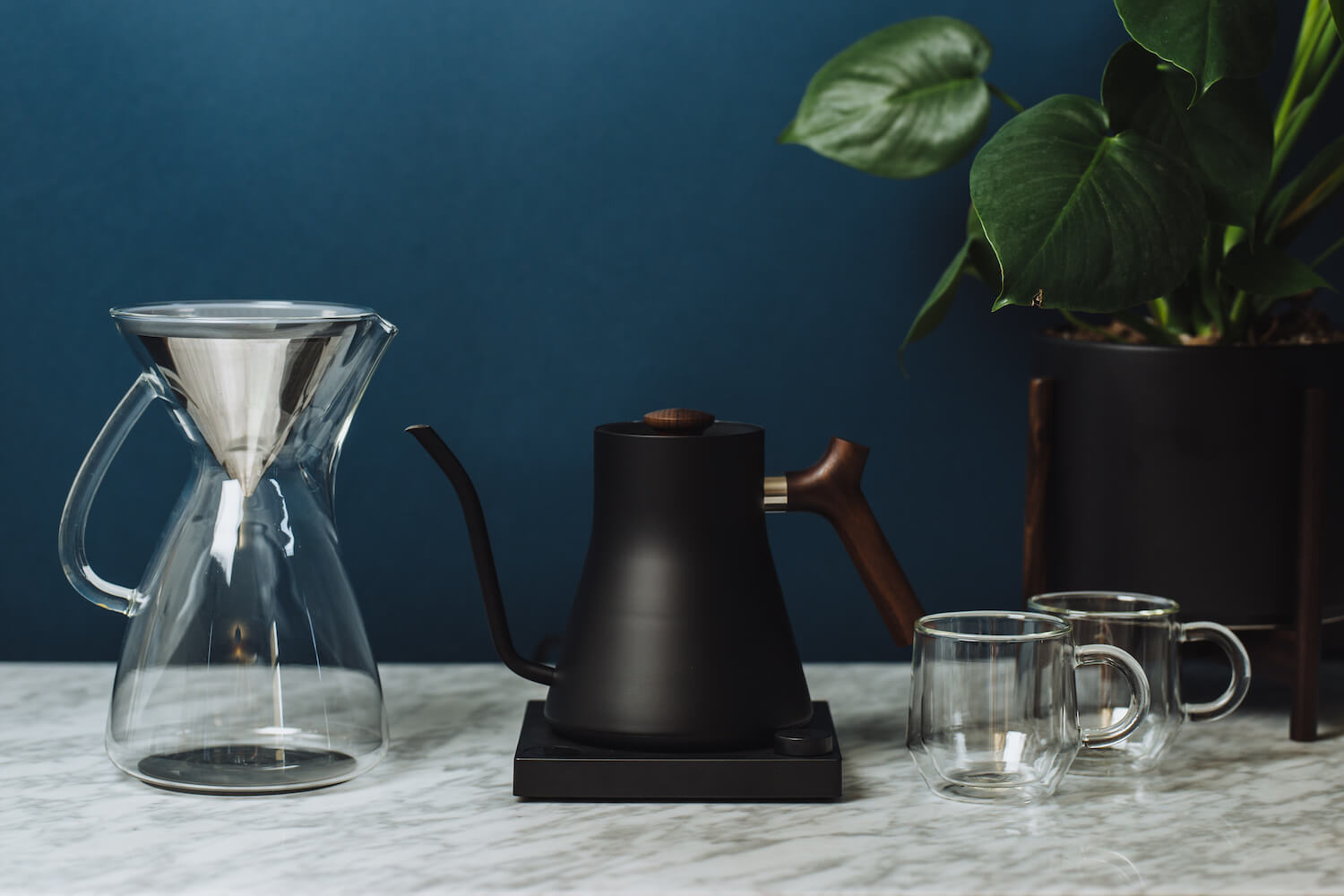 The glass carafe and Kone pictured with an electric kettle. 
