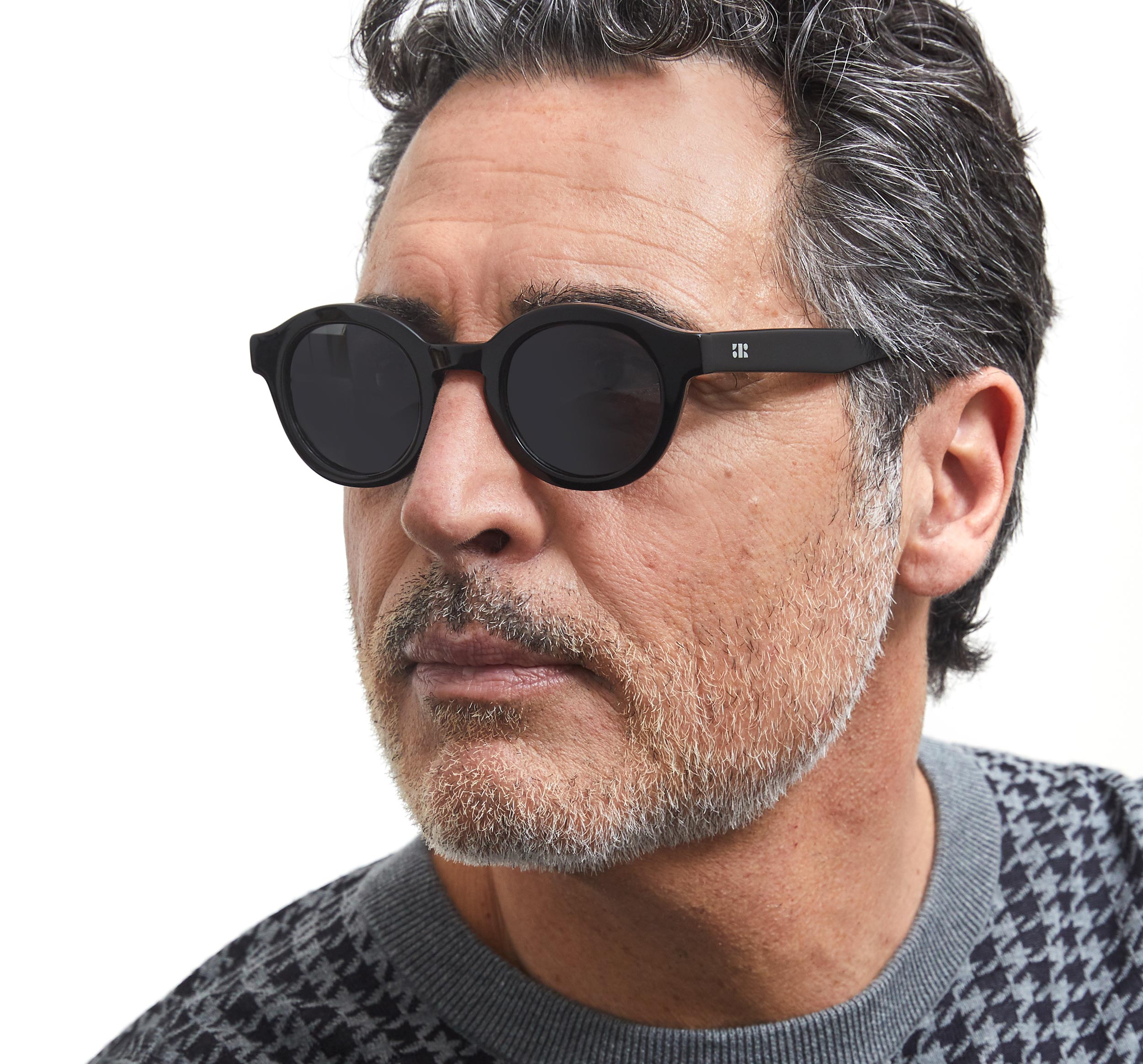 Photo of a man or woman wearing Eden Sun Black Sun Glasses by French Kiwis