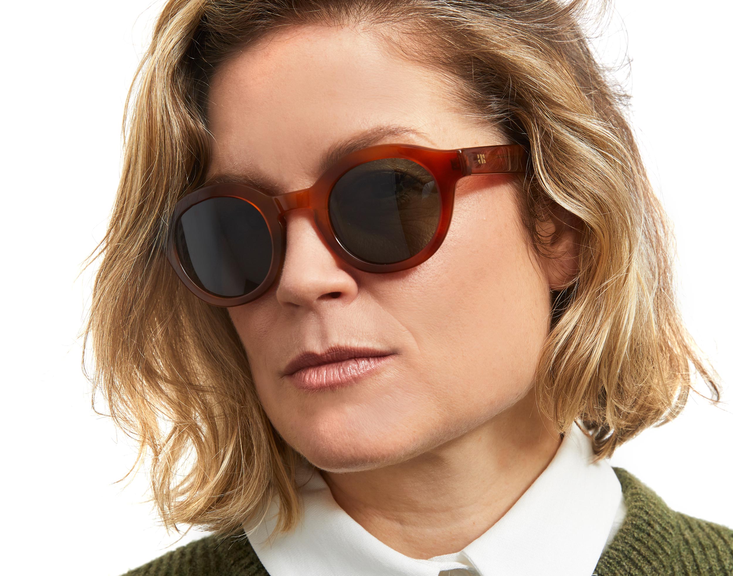 Photo of a man or woman wearing Eden Sun Cognac Sun Glasses by French Kiwis