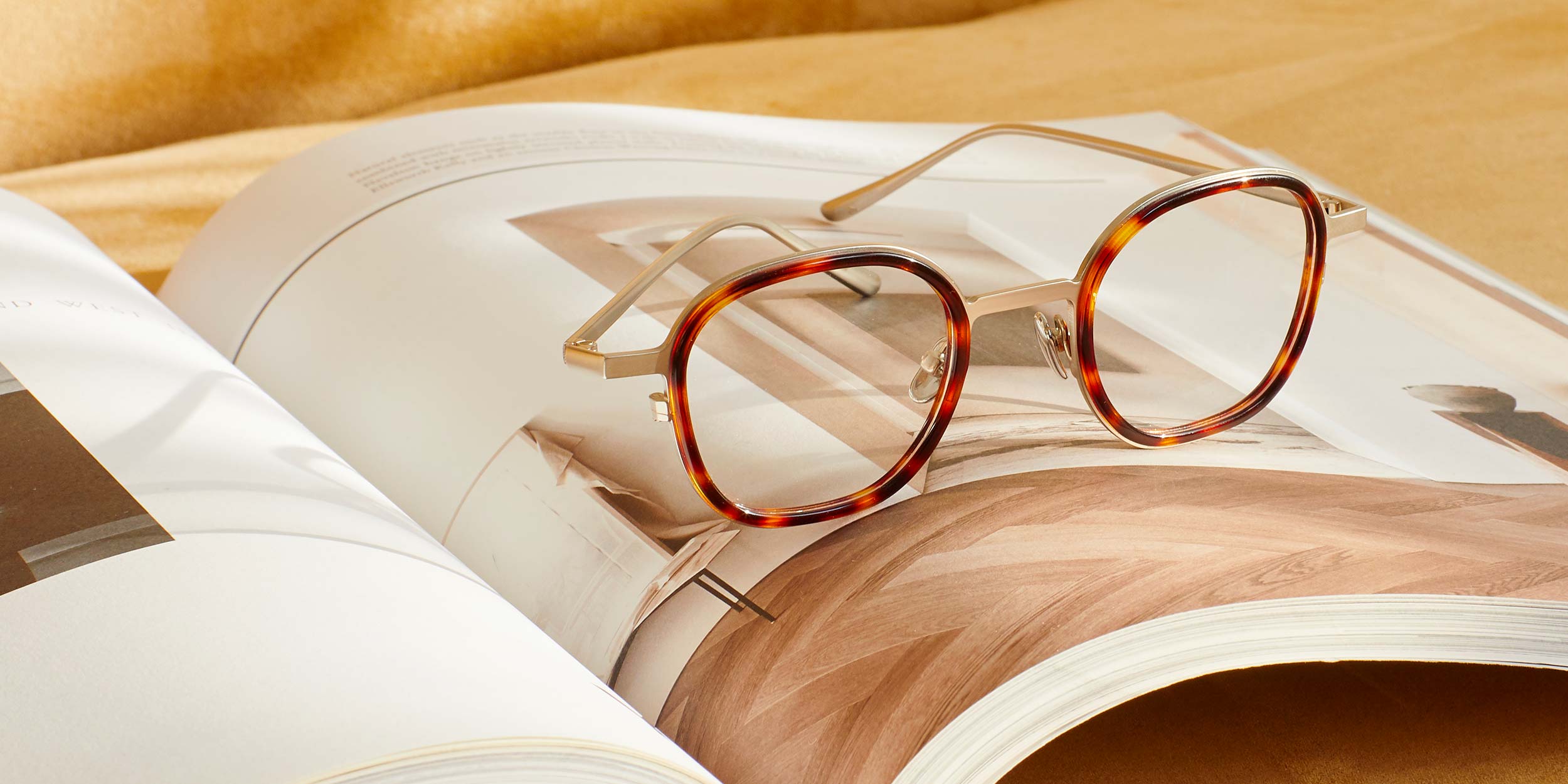 Photo Details of Thierry Brown Marble & Mat Gold Reading Glasses in a room