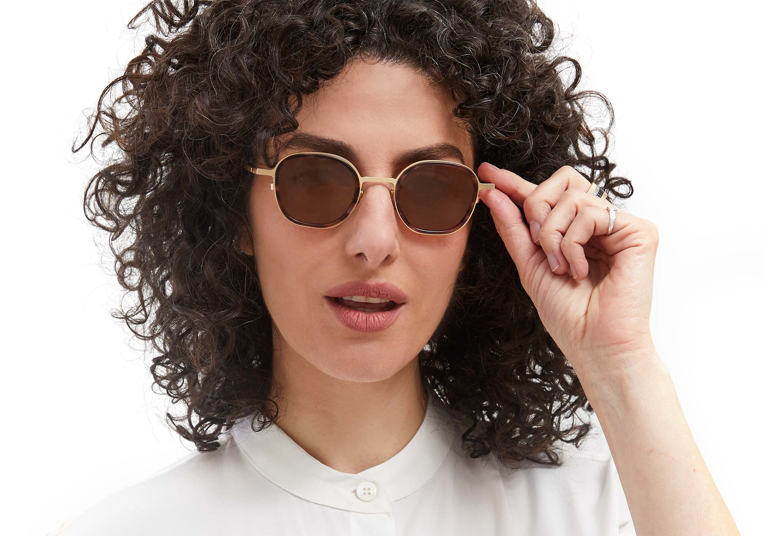 Photo of a man or woman wearing Thierry Sun Brown Marble & Mat Gold Sun Glasses
