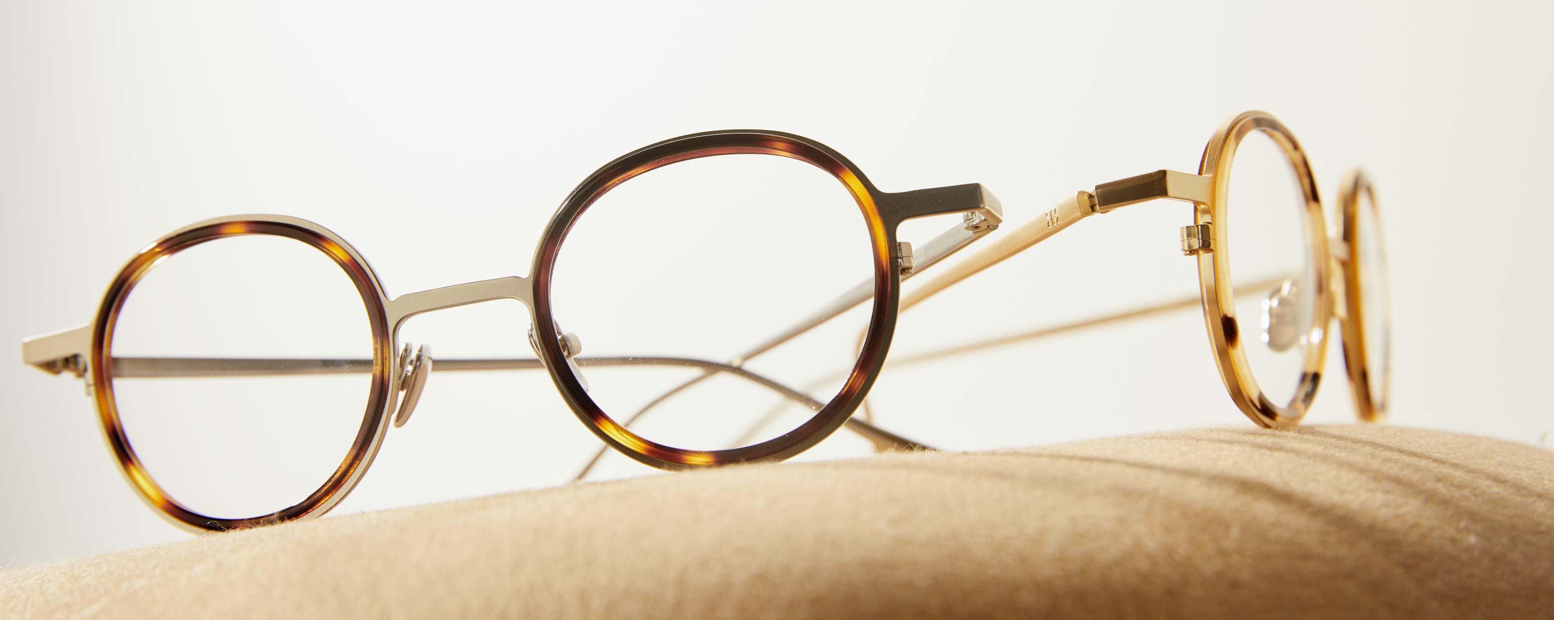 Photo Details of Arthur Brown Marble & Mat Gold Reading Glasses in a room