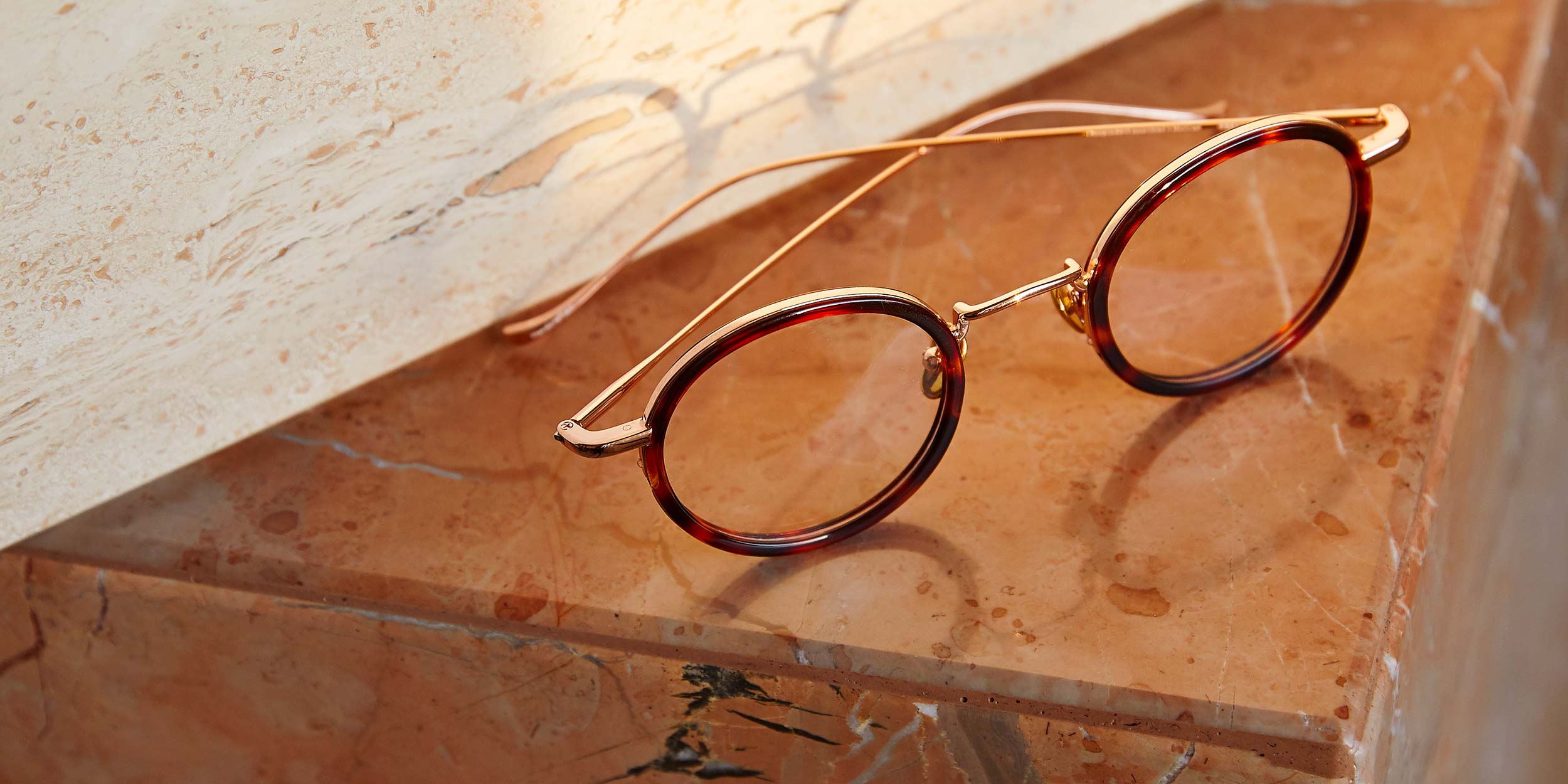 Photo Details of Nicolas Tortoise & Rose Gold Reading Glasses in a room