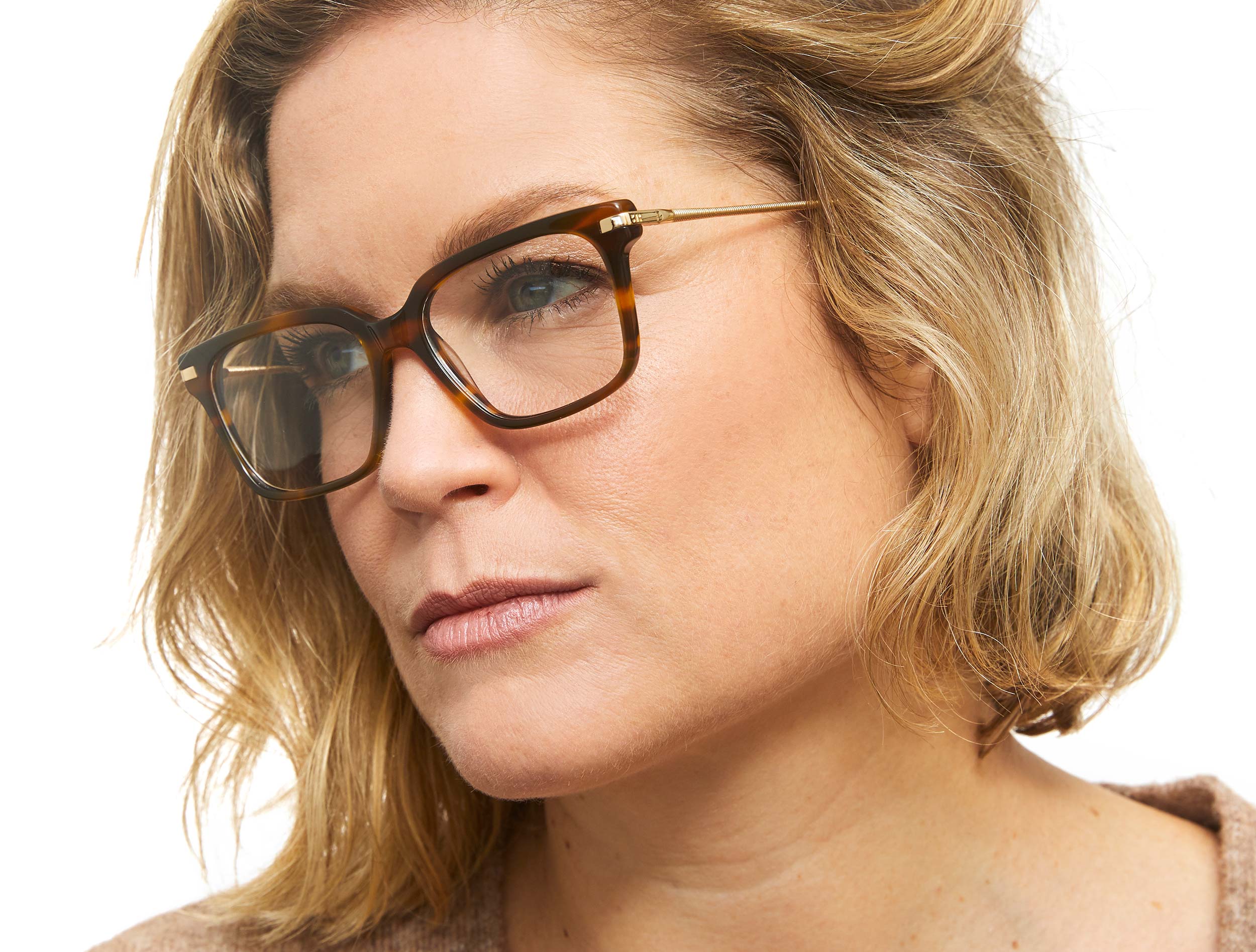 Photo of a man or woman wearing Sasha Black & Gold Reading Glasses by French Kiwis