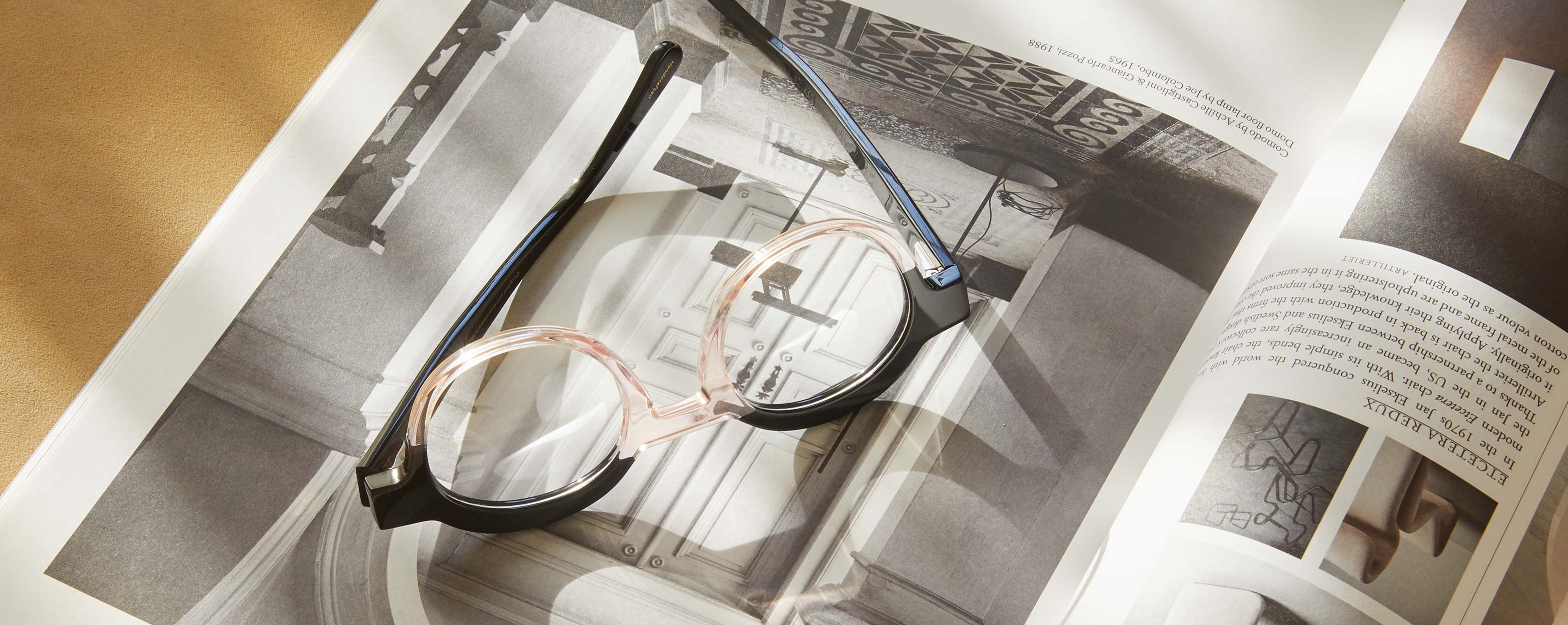Photo Details of Charlotte Black & Clear Pink Reading Glasses in a room