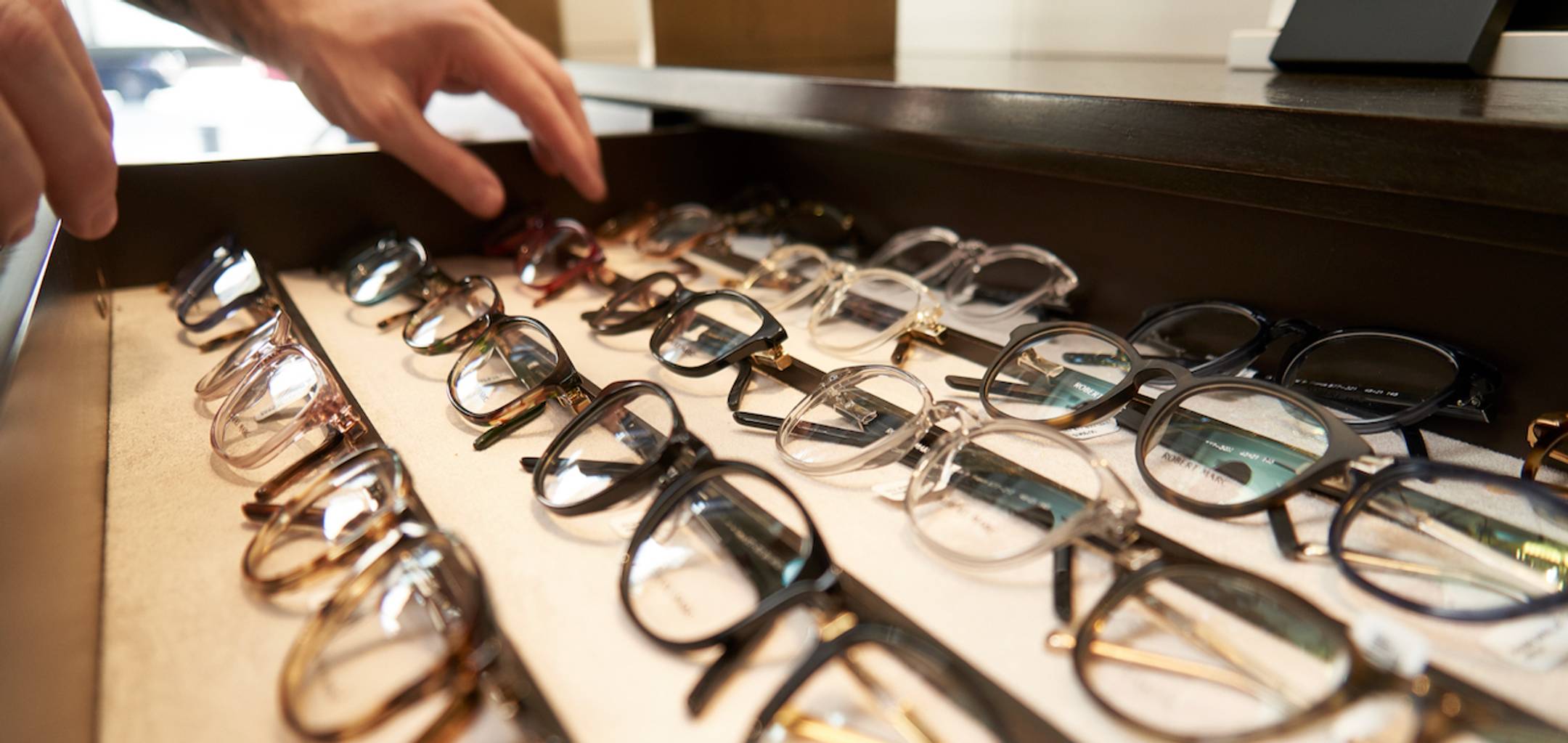 Close up of multiple pairs of eyeglasses