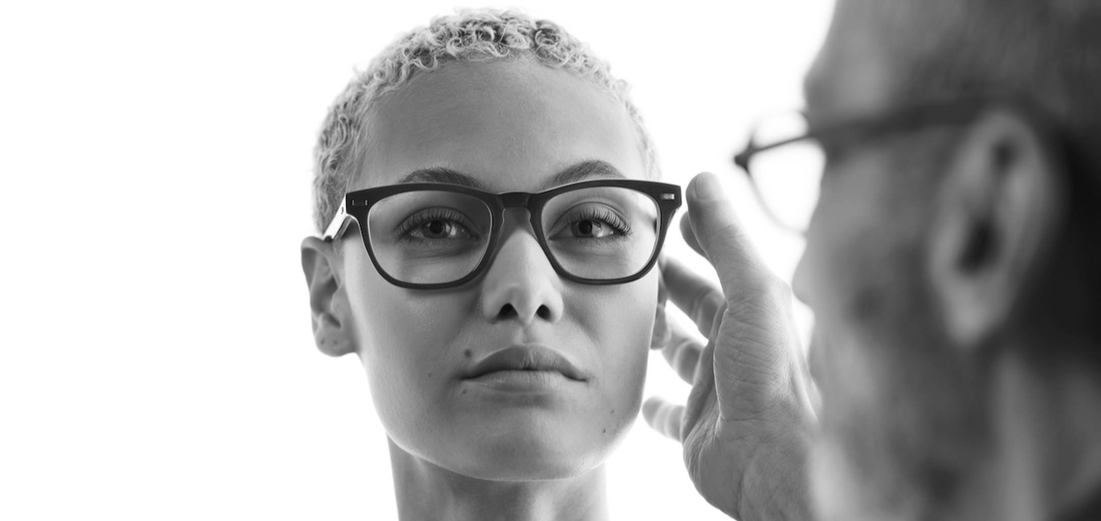 Female model being fitted with Morgenthal Frederics eyeglasses