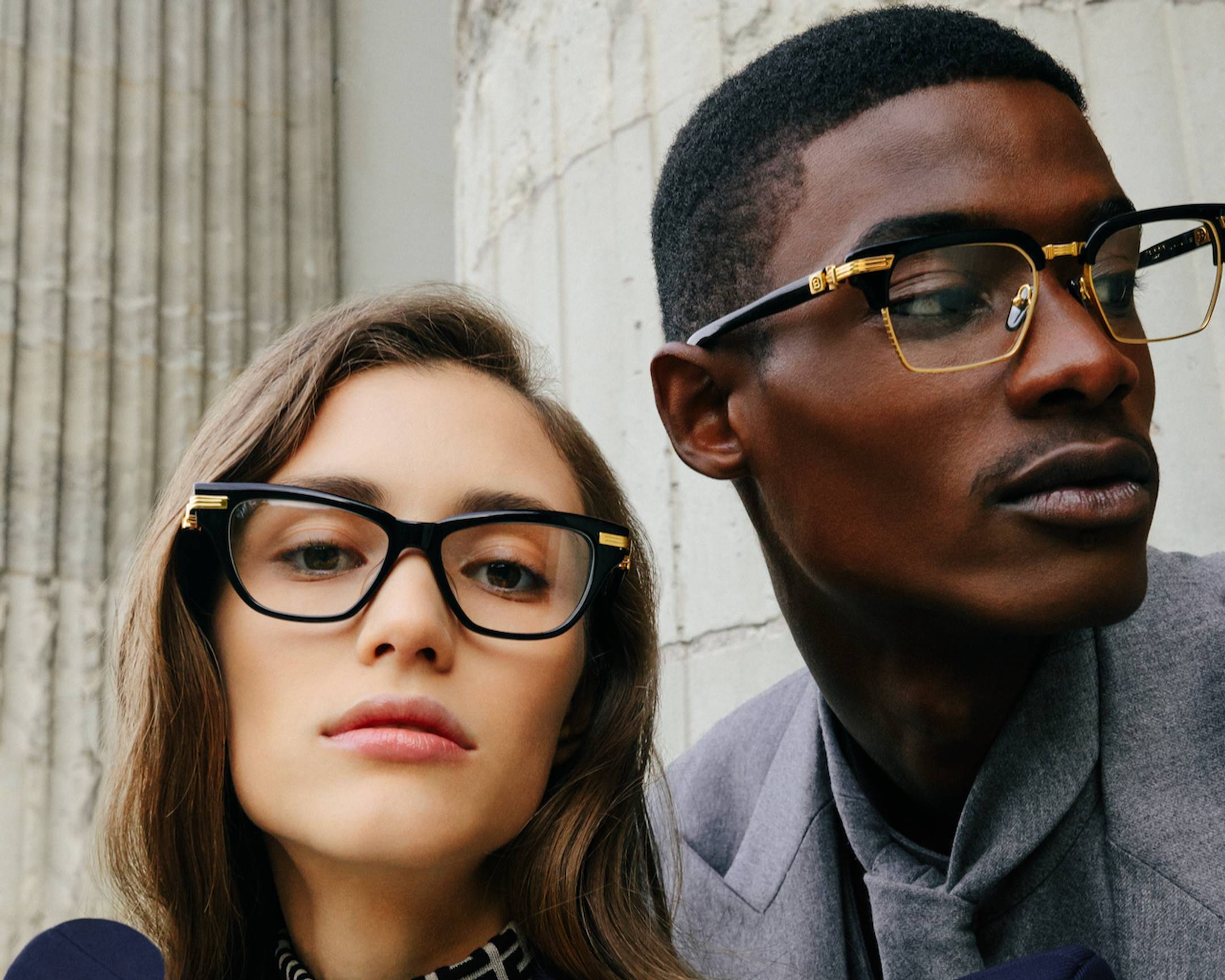 Male and female model wearing Balmain eyeglasses