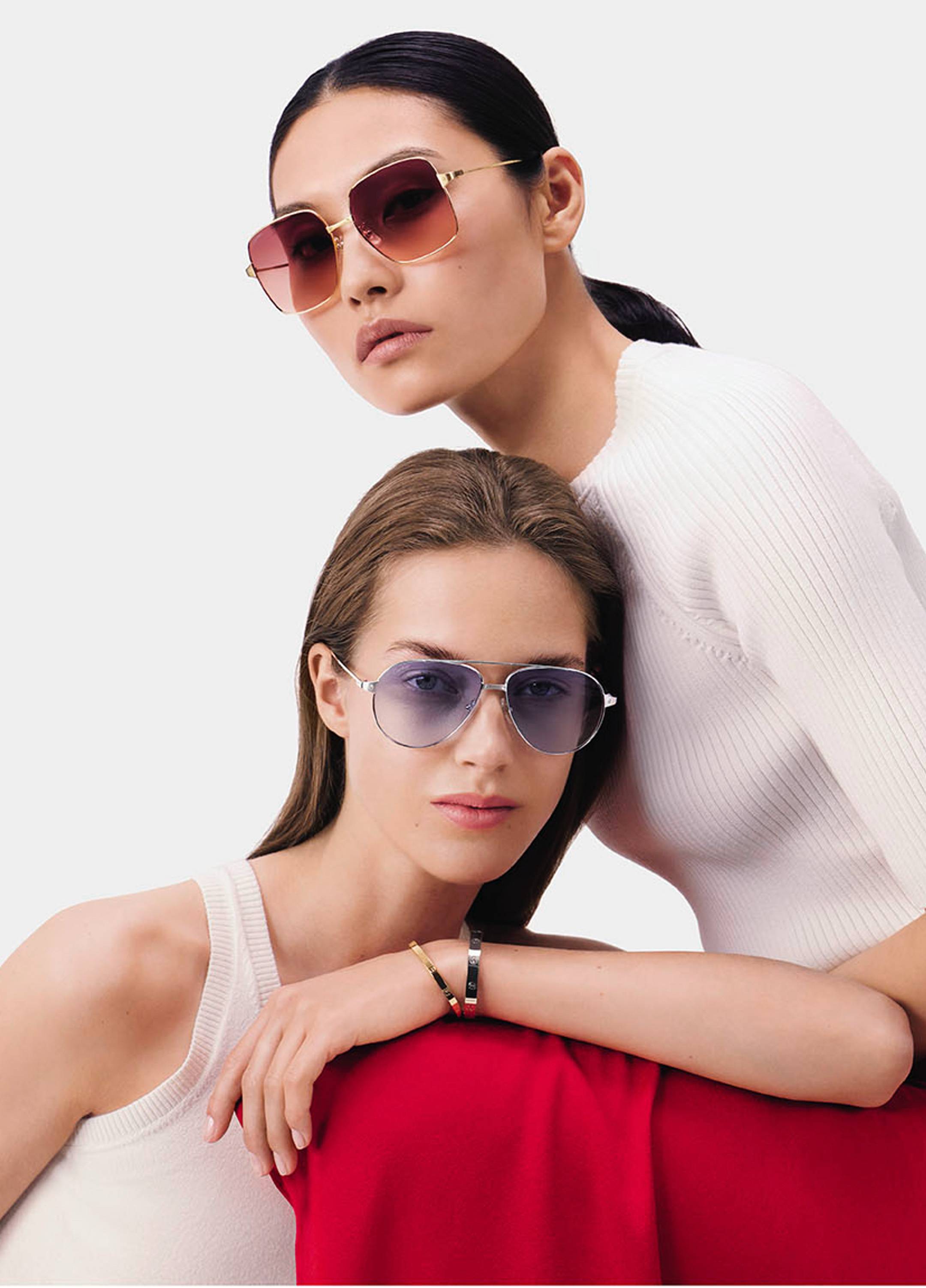 Two female models wearing Cartier sunglasses
