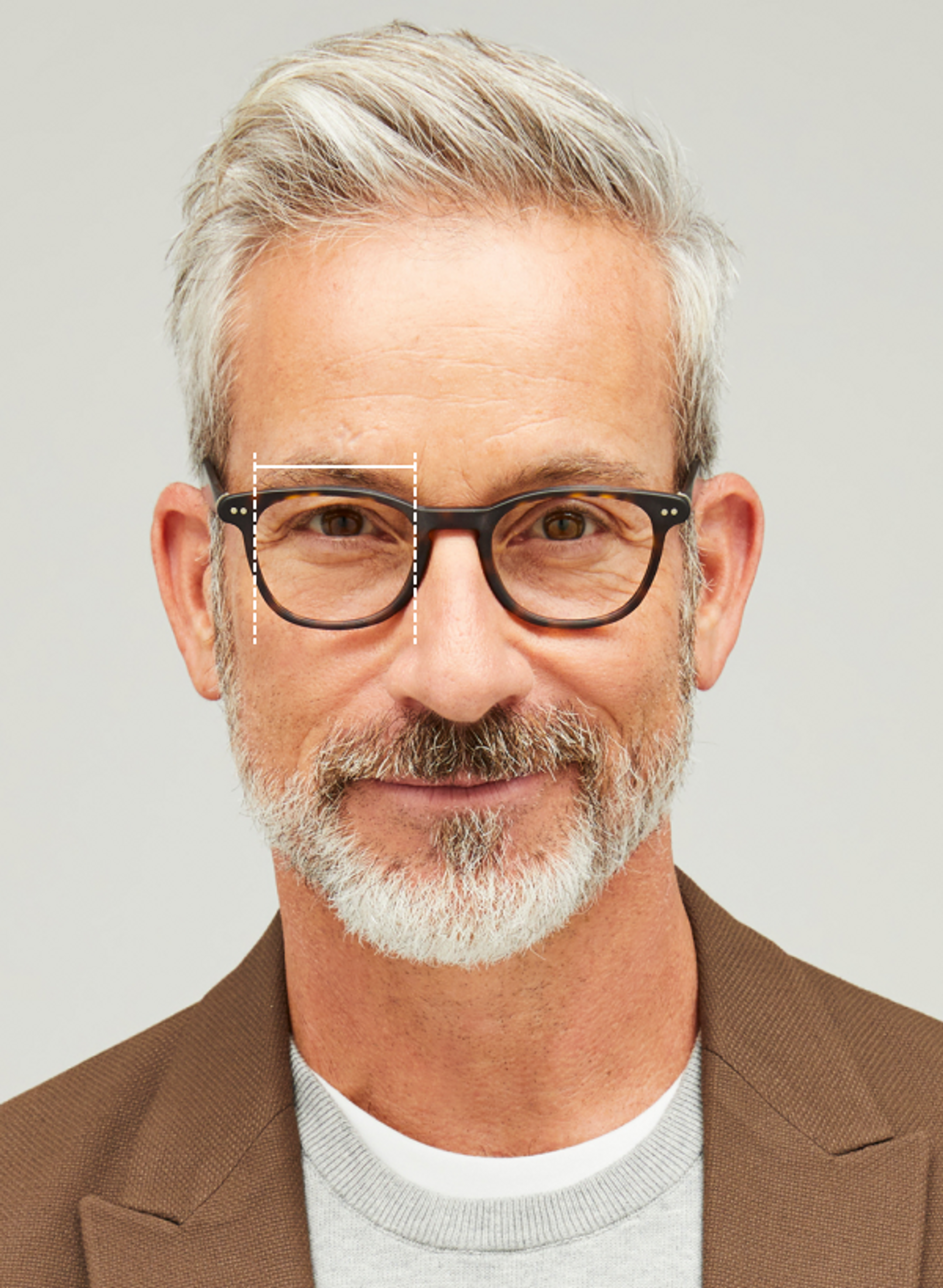 Male model wearing eyeglasses with cross hairs over one eye