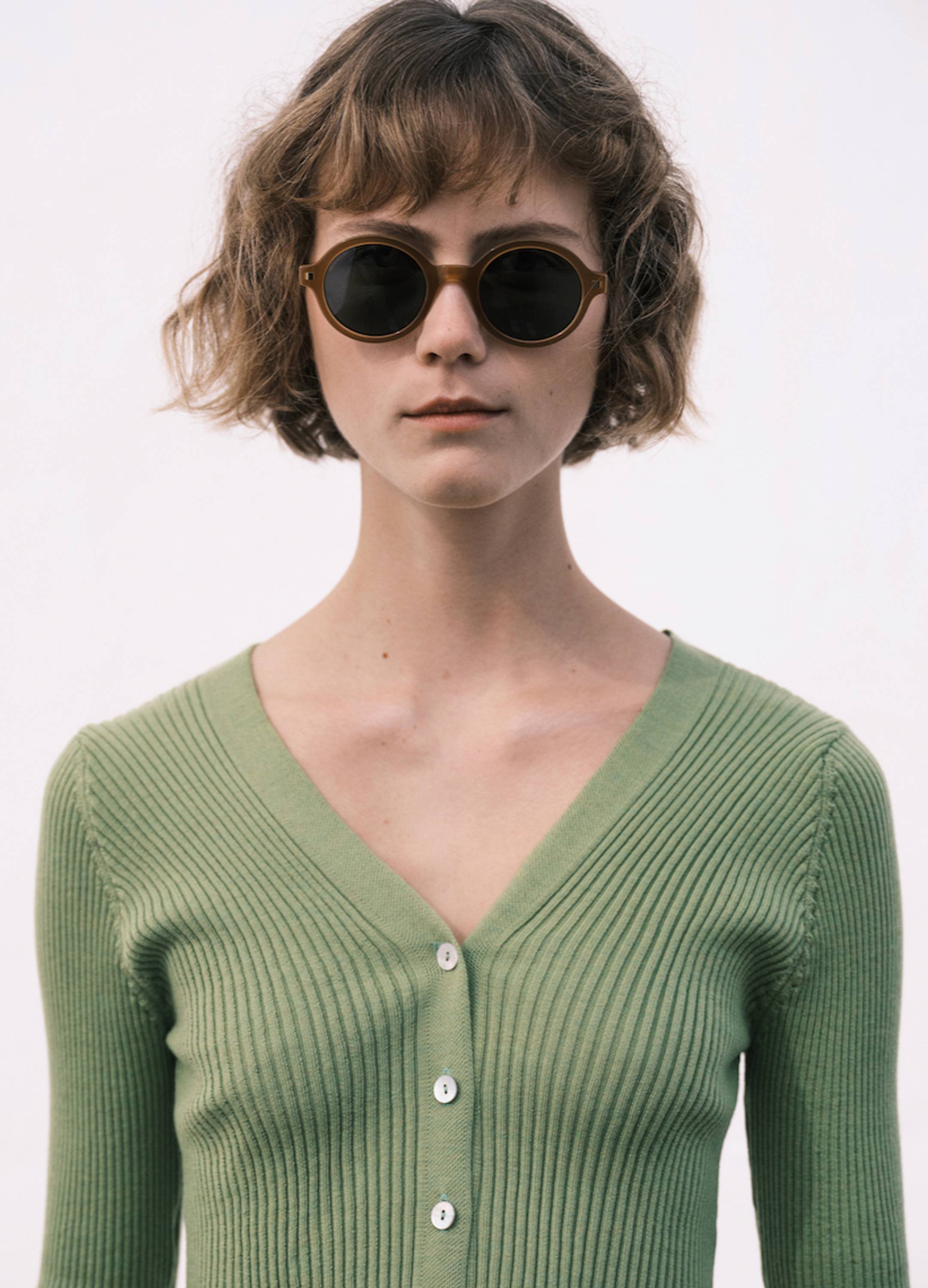 Female model wearing Mykita sunglasses