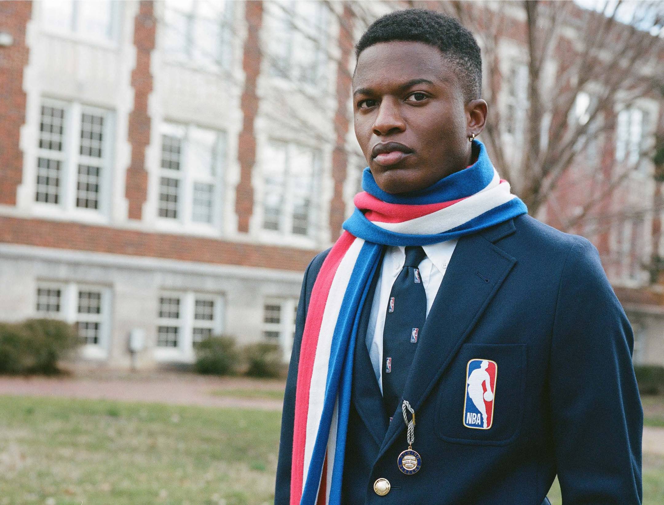 Model wearing the NBA Logo Scarf, Tie, and Blazer outside of The Graduate Chapel Hill.
