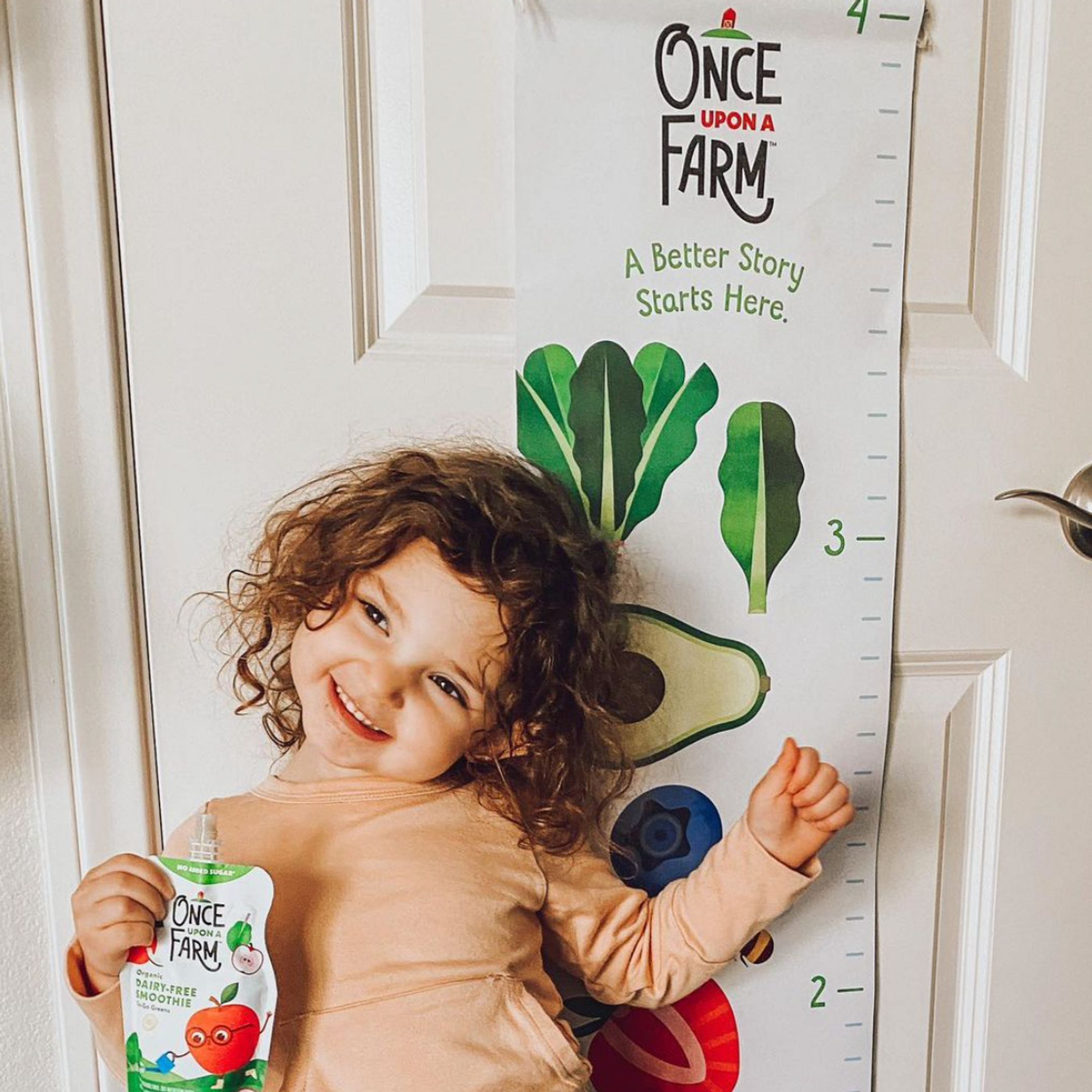 Girl with a Once Upon a Farm pouch